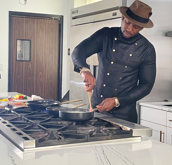 Darian Bryan cooking in kitchen